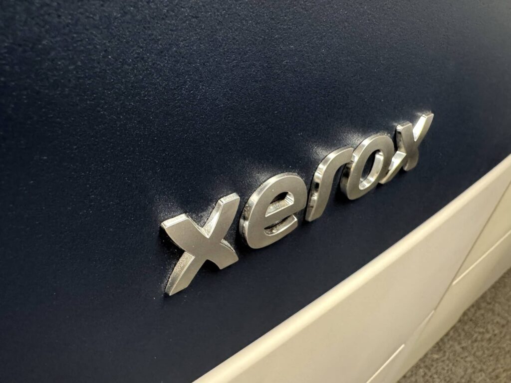 Xerox logo on the front of a printing machine